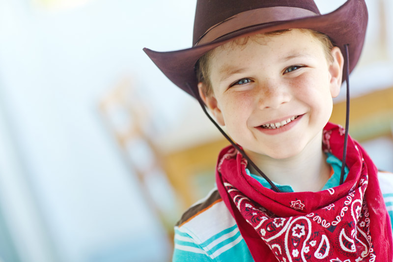 Kid in cowboy hat and bandana