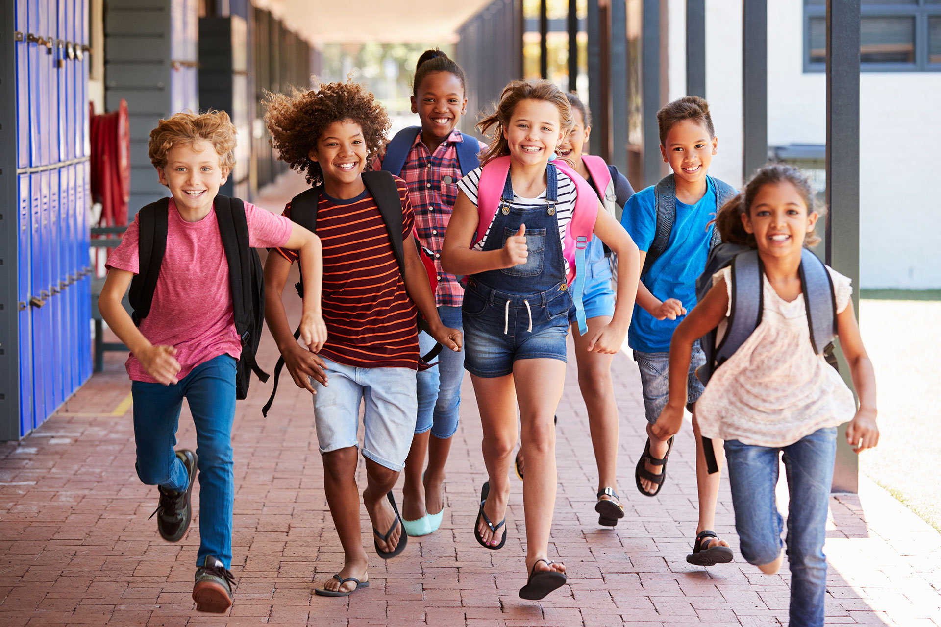 Kids running past lockers